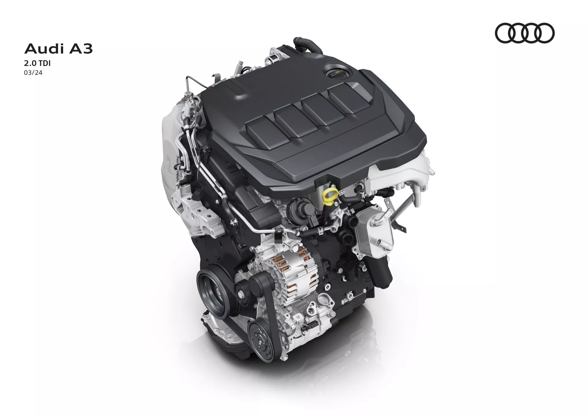 Pogled od zgoraj na motor Audi A3 2.0 TDI na belem ozadju, poudarja pokrov motorja z logotipom Audi in ključne tehnološke komponente