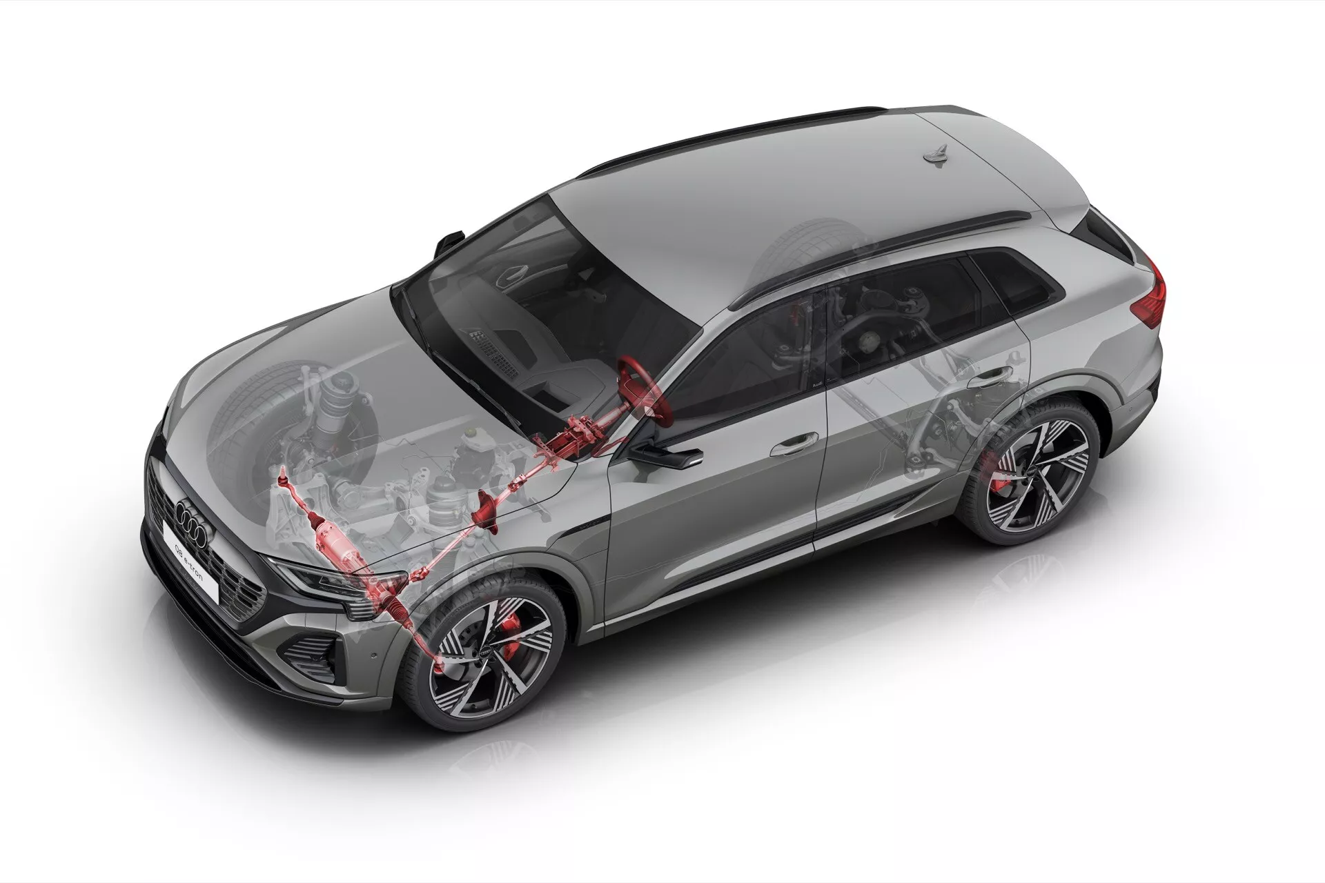 Sivo crossover SUV Audi Q8 e-tron 2023 v ptičji perspektivi prikazuje strešno okno, strešne nosilce, anteno, aerodinamično obliko pokrova motorja, desna lita kolesa z nizkoprofilnimi pnevmatikami in napredne varnostne funkcije